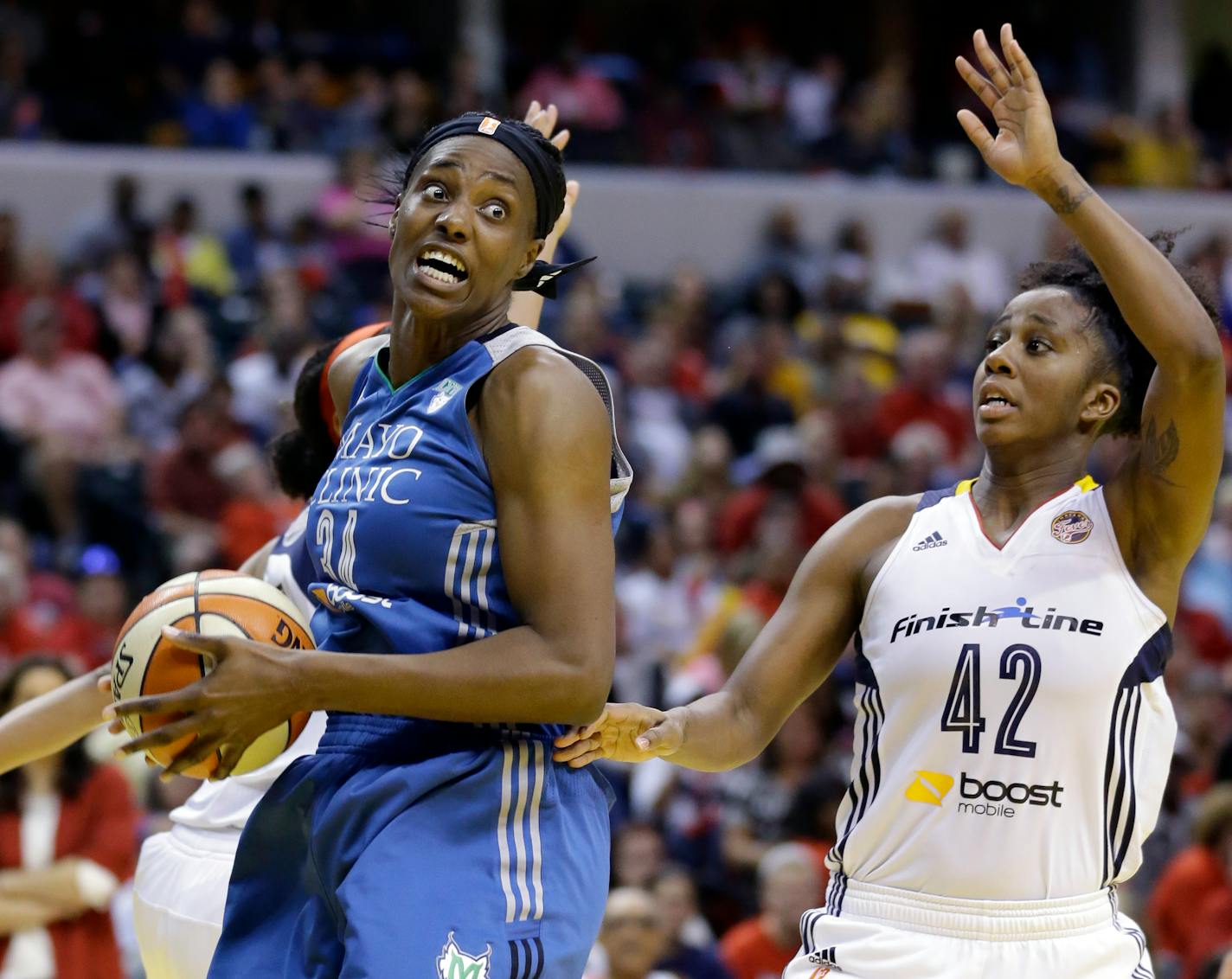 Lynx center Sylvia Fowles, left, headed to the basket as Indiana's Shenise Johnson defended in the second half of Game 4 of the WNBA Finals on Sunday.