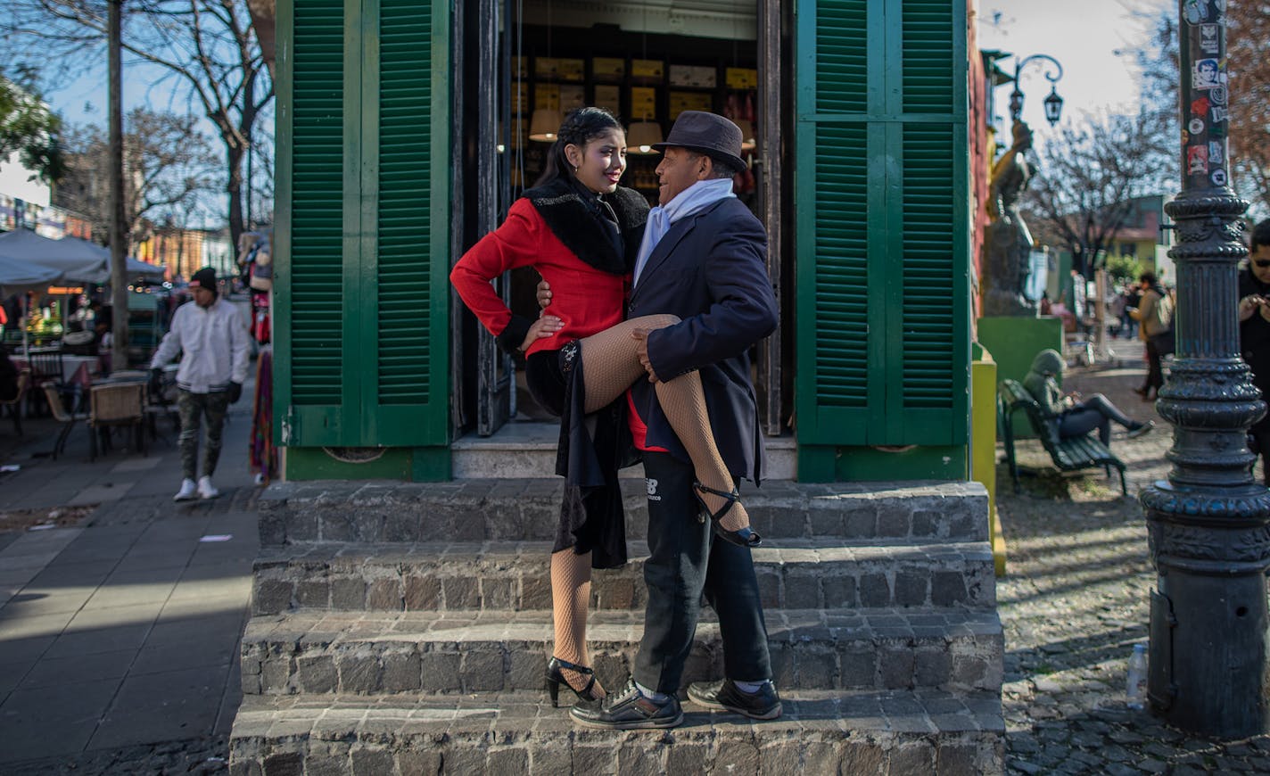 Julia Hernandez, who earns her living posing for tango-themed photographs with tourists, strikes a classic pose in the El Caminito district of Buenos Aires, Argentina, July 6, 2019. A group of activists is trying to make tango less dogmatic about traditional gender roles, and more assertive about rooting out sexual harassment and assault. (Victor Moriyama/The New York Times) ORG XMIT: XNYT78