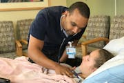 Hakeem Abdulwahab checked in with Lina Bergert, a patient at Gillette Children's Specialty Healthcare in St. Paul.