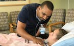 Hakeem Abdulwahab checked in with Lina Bergert, a patient at Gillette Children's Specialty Healthcare in St. Paul.