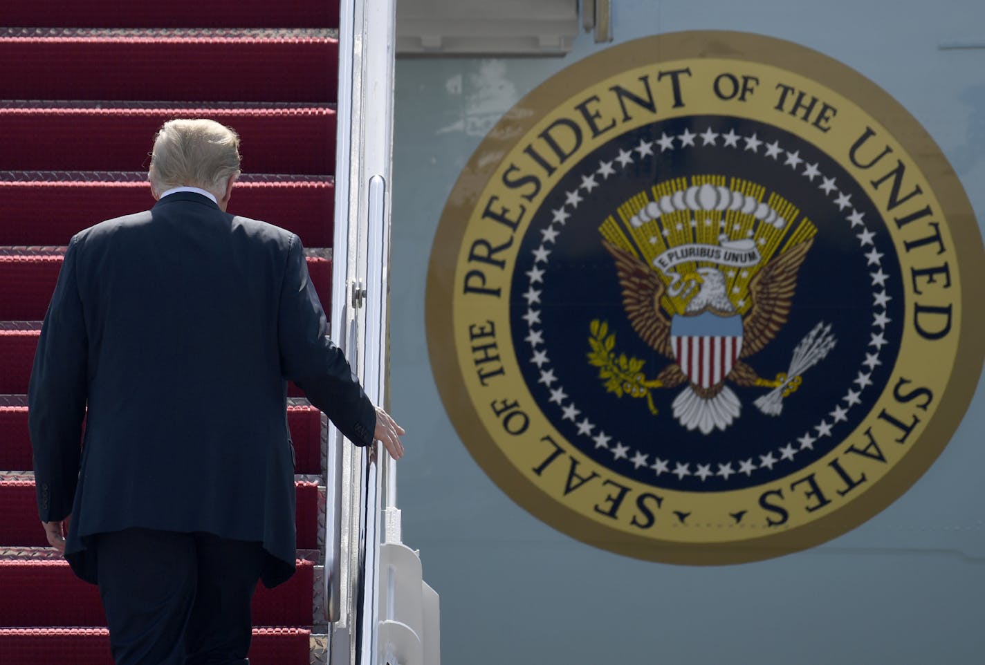 President Donald Trump walk up the steps of Air Force One at Andrews Air Force Base in Md., Tuesday, June 23, 2020. Trump is heading to Arizona and is scheduled to visit Yuma to look at the border wall he's championed before flying to Phoenix to speak at a "Students for Trump" rally. (AP Photo/Susan Walsh)