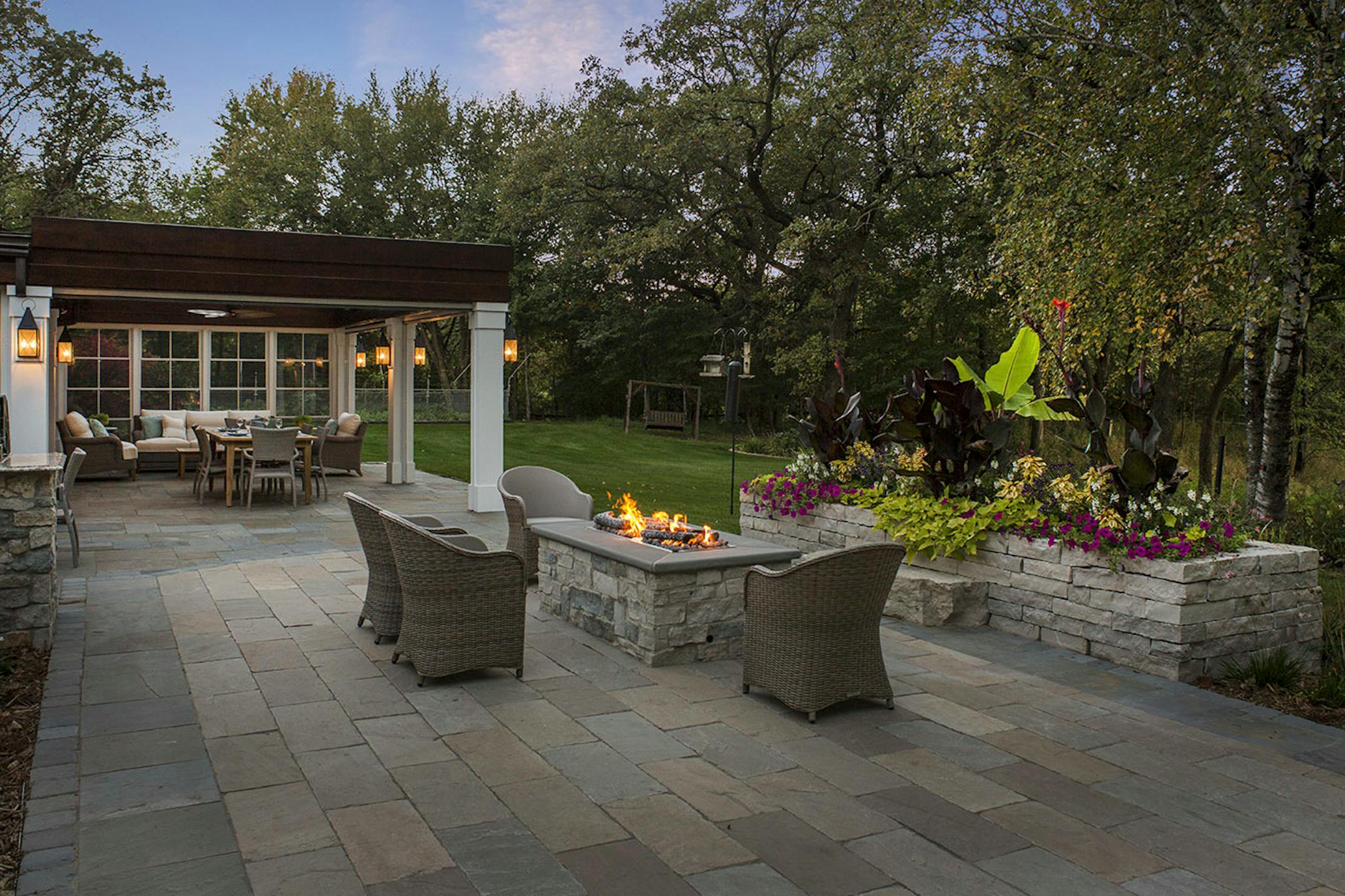A firepit and stone planter were part of the backyard makeover.