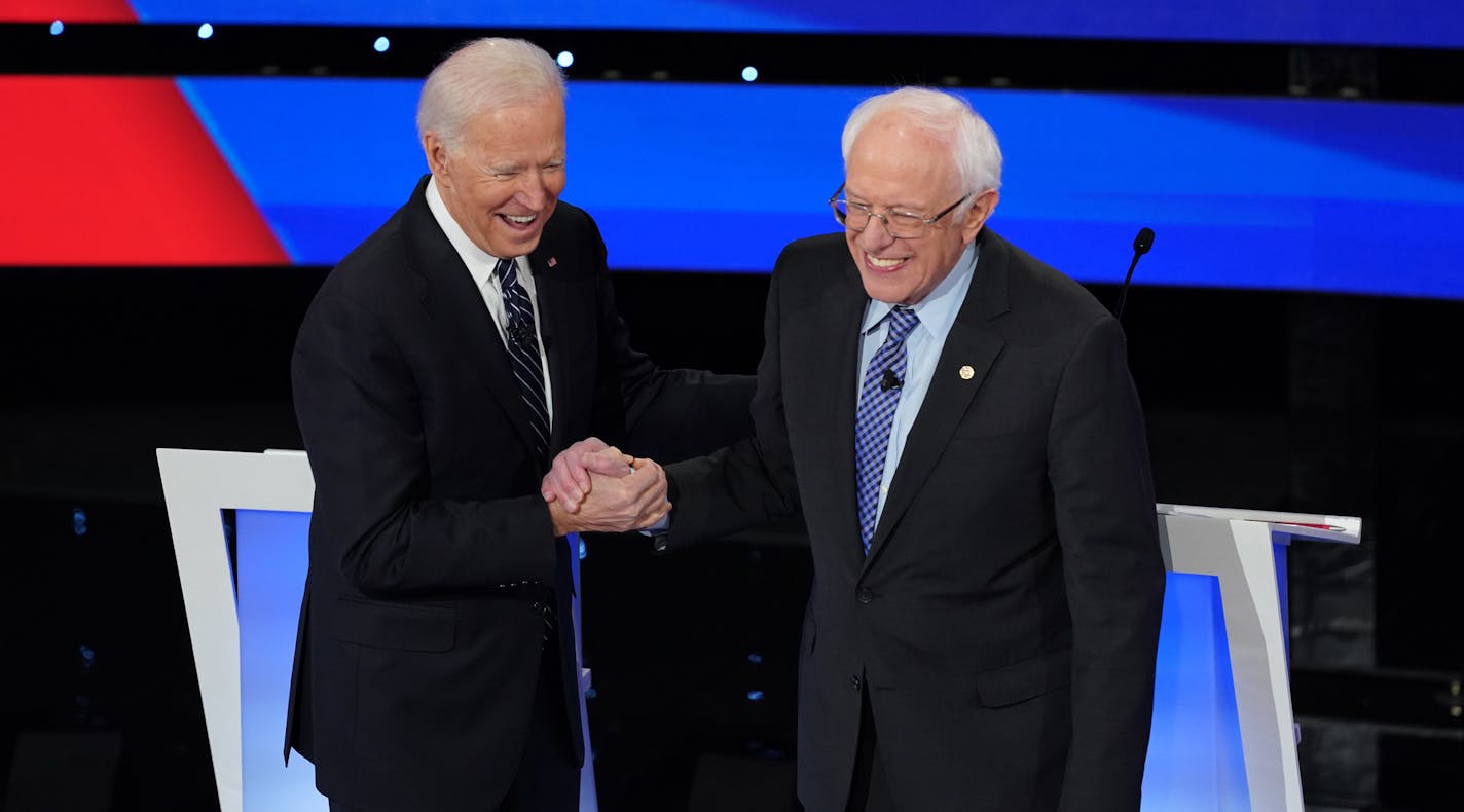 FILE -- Former Vice President Joe Biden shakes hands with Sen. Bernie Sanders (I-Vt.) during the Democratic presidential debate at Drake University in Des Moines, Iowa, Jan. 14, 2020. Sanders endorsed Biden as the Democratic nominee for president on Monday, April 13, adding the weight of his left-wing support to Biden&#x2019;s candidacy and taking a major step toward bringing unity to the party&#x2019;s effort to unseat President Donald Trump in November. (Tamir Kalifa/The New York Times)