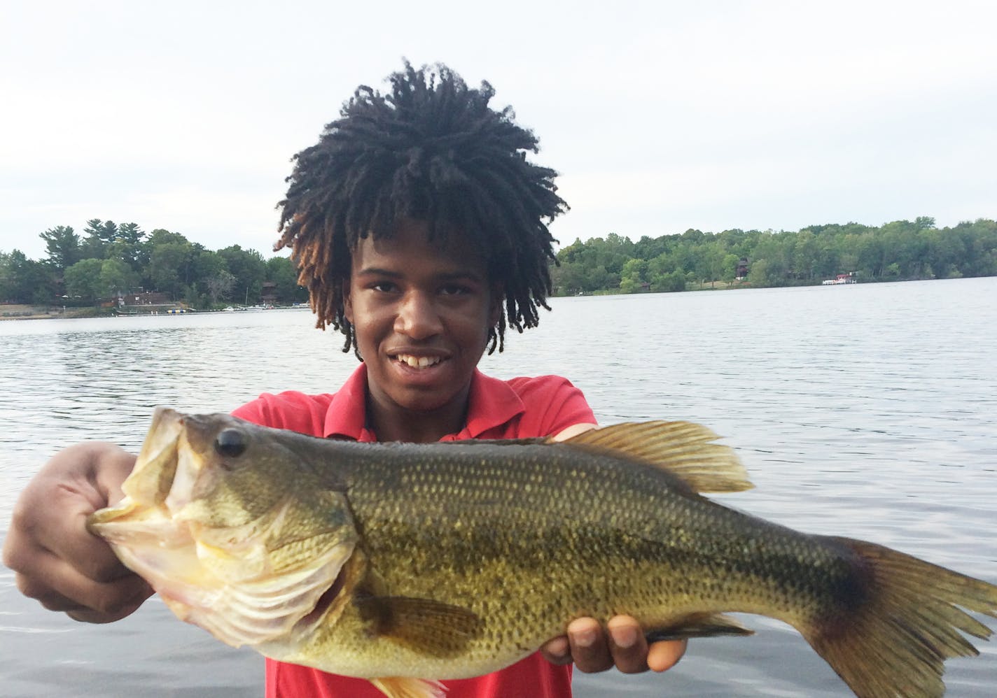 BAY LAKE BASS Isaiah Hardin of Minneapolis caught this 4.5-pound largemouth bass on Bay Lake. He caught it on a minnow and Lindy rig -- and nearly lost the fish in the weeds.