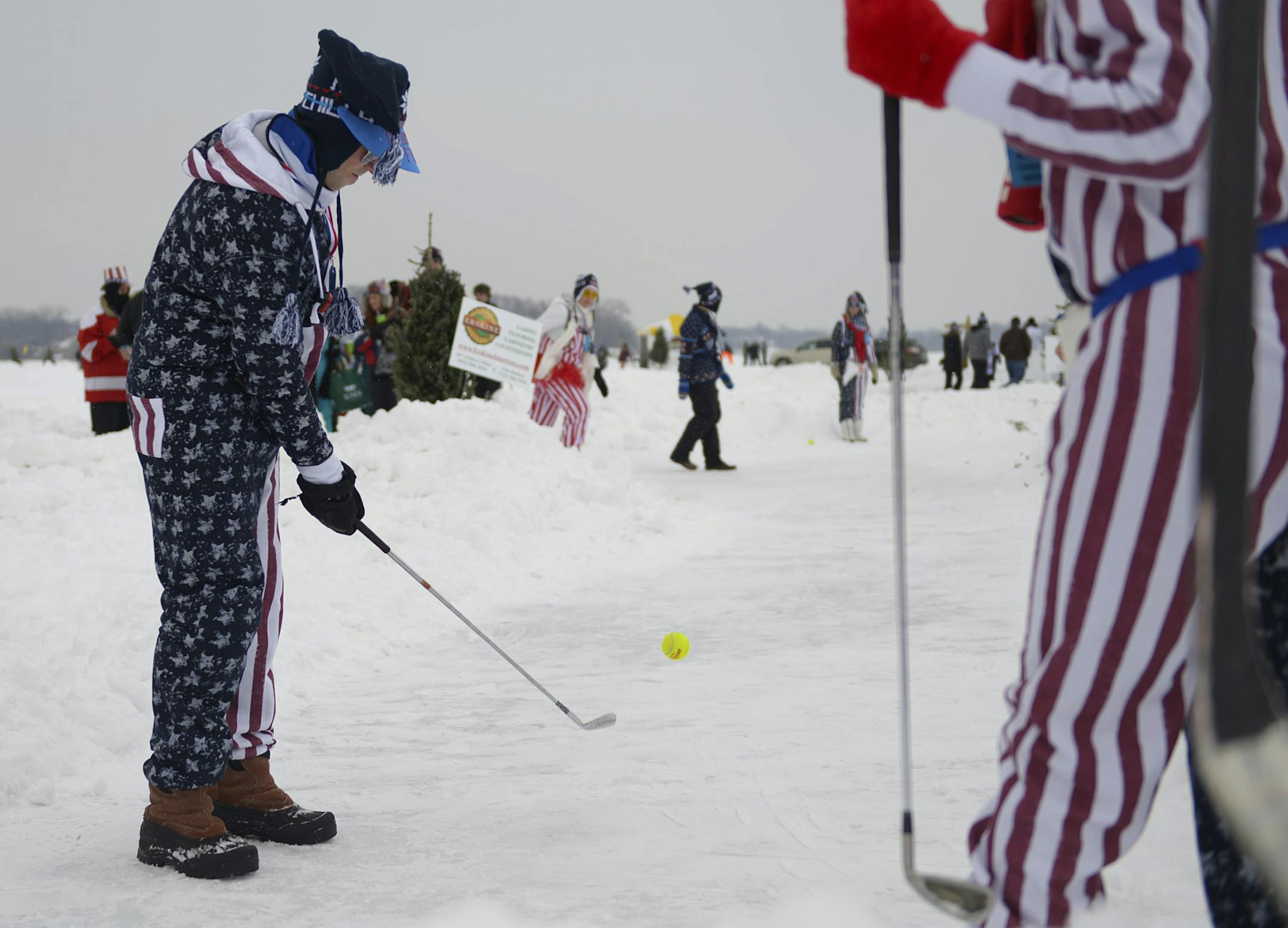 Maple Grove resident Igor Gelemeev swings at the sixth hole at the Wayzata Chilly Open Frozen Golf Tournament on Saturday February 8, 2014. ] (AMANDA SNYDER/ Special to the Star Tribune)
