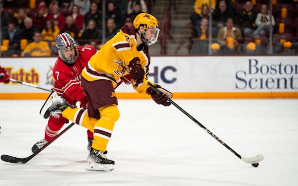 Gophers forward Jimmy Clark got off a shot against Ohio State on Jan. 20 at 3M Arena at Mariucci.