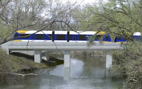 A rendering of the Southwest Light Rail train passing through the Kenilworth Lagoon ORG XMIT: MIN1605131425430376 ORG XMIT: MIN1605181436410516 ORG XM
