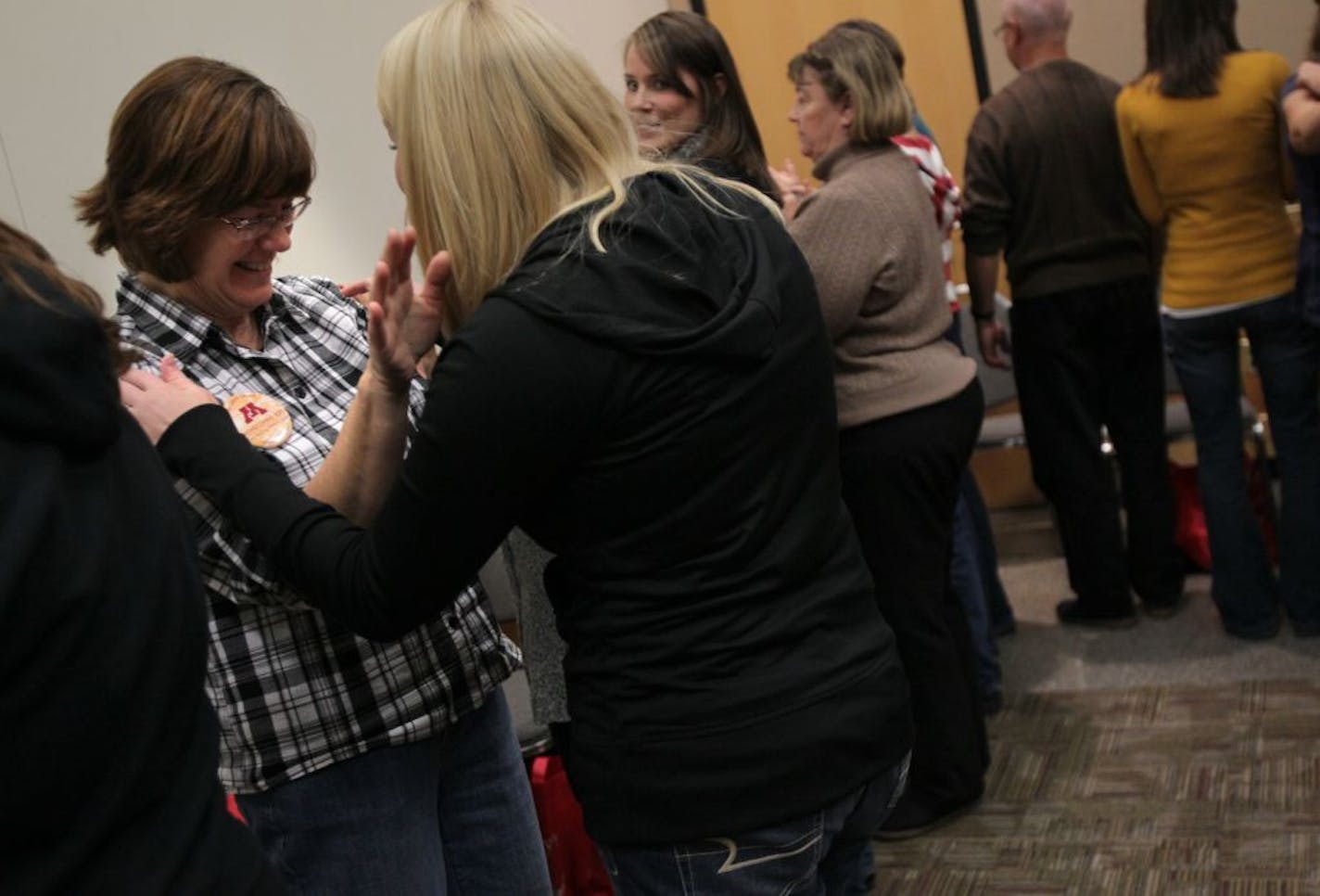 New Life Academy teachers Pam Bravo, left, and Kerri Kent laughed as they did a little dance during an activity in a class about how singing helps improve math and language in students during the MEA teacher's conference in St. Paul, Minn., Thursday, October 20, 2011.