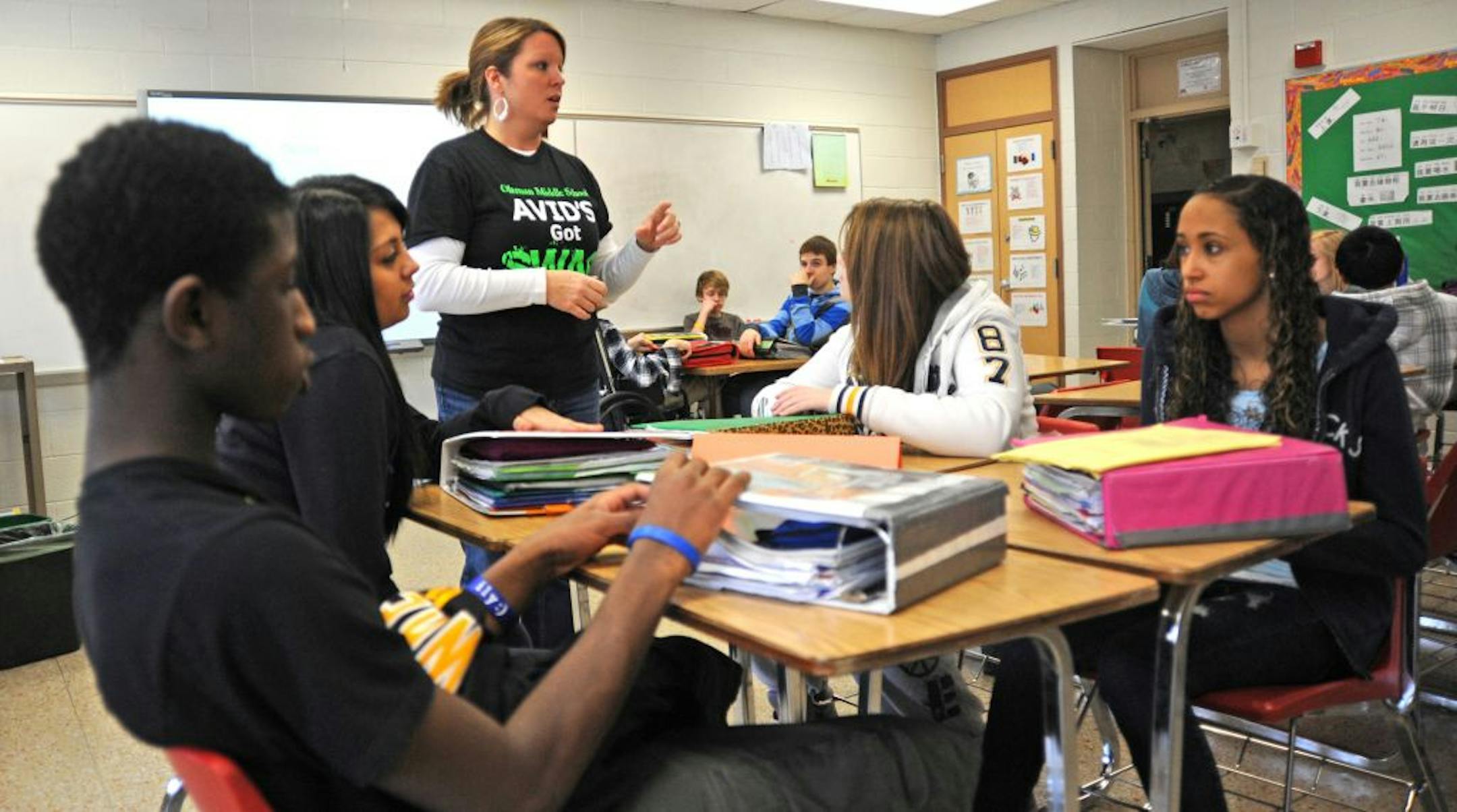 Gina Gamnis talked to her 8th grade class about good study habits during a class at Oltmann Middle School in St. Paul Park, Minn. AVID is a program designed to help encourage students to think about college. Students receive tutoring, career advice and mentoring. South Washington's programs have received accolades from students and parents alike and now administrators are looking to expand the program to middle schools. .