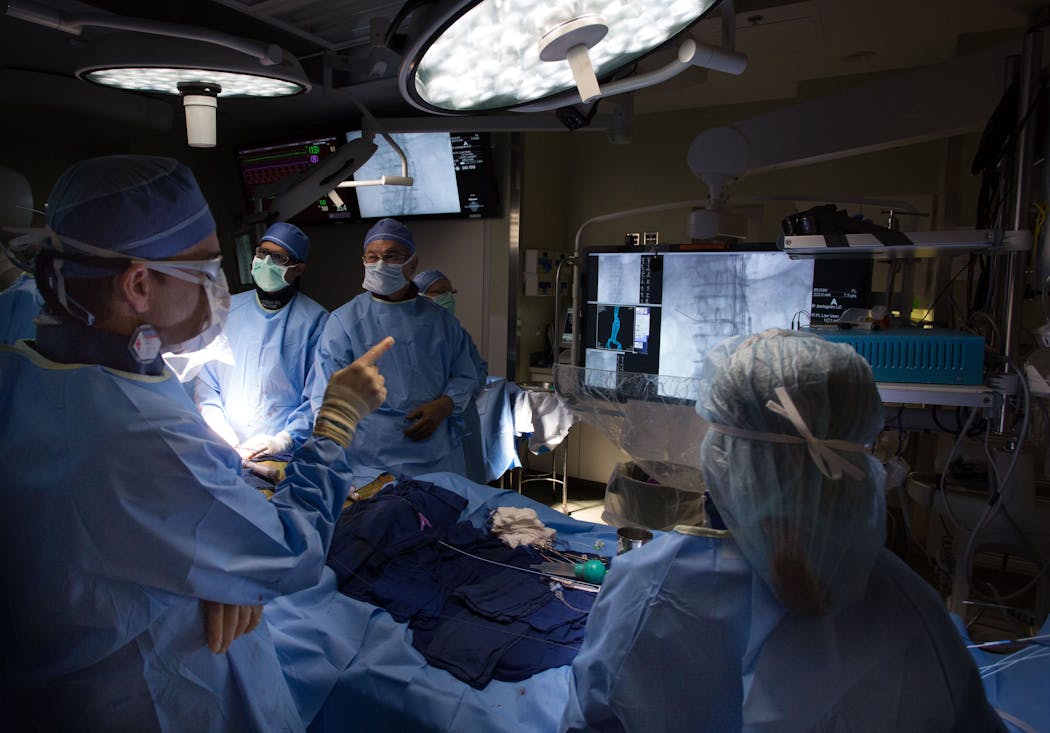 Doctors and other staff at Mayo Clinic prepared to place an experimental stent into a patient in 2016.
