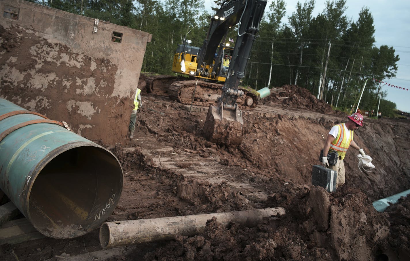 In an Aug. 21, 2017 photo, workers make sure that each section of the replacement Line 3 that is joined passes muster. Enbridge already has started building the 14-mile stretch of Line 3 from the Minnesota line to its terminal in Superior, Wis. In filings with the Public Utilities Commission Monday, Sept. 11, The Minnesota Department of Commerce says Enbridge Energy has failed to establish the need for its proposal to replace its aging Line 3 crude oil pipeline across northern Minnesota. Instead