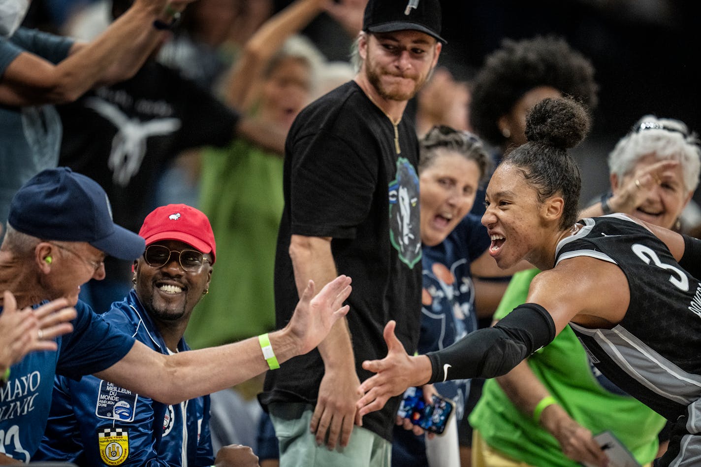 Minnesota Lynx forward Aerial Powers, (3) celebrates with fans in the 2nd half .Powers scored 35 points in the game helping the Lynx to a 118 -107 double overtime win over Phoenix in Minneapolis Minn., on Tuesday July 12, 2022.