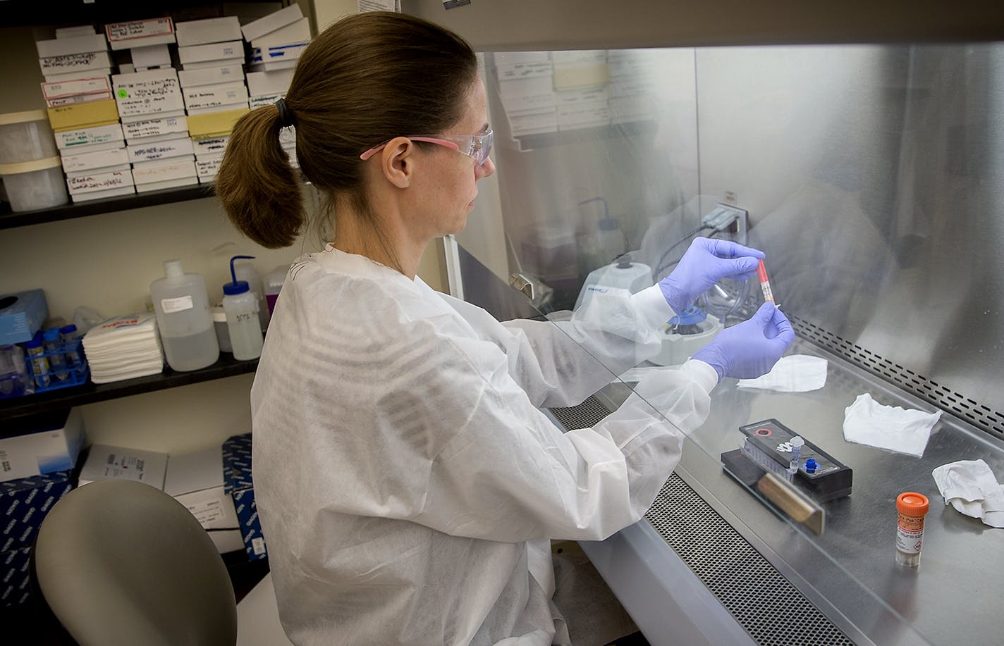 Lab Specialist Elizabeth Cebelinski used new technology as she tested for the cyclospora parasite at the state Health Department, Monday, June 18, 2018 in St. Paul, MN. ] ELIZABETH FLORES &#xef; liz.flores@startribune.com