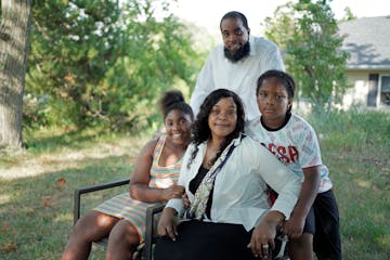 Benedda Cotten and Terry Davis with their two children last week at their home in Eden Prairie.  