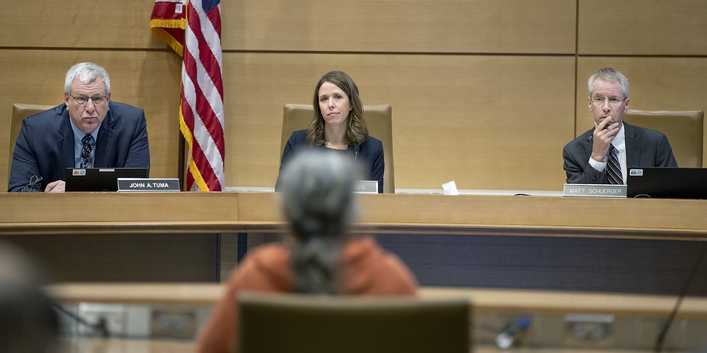 PUC commissioners John Tuma, left, Katie Sieben, center, and Valerie Means (not pictured) voted in favor of the revised EIS. Matt Schuerger, right, voted against it. (Elizabeth Flores/Star Tribune via AP)