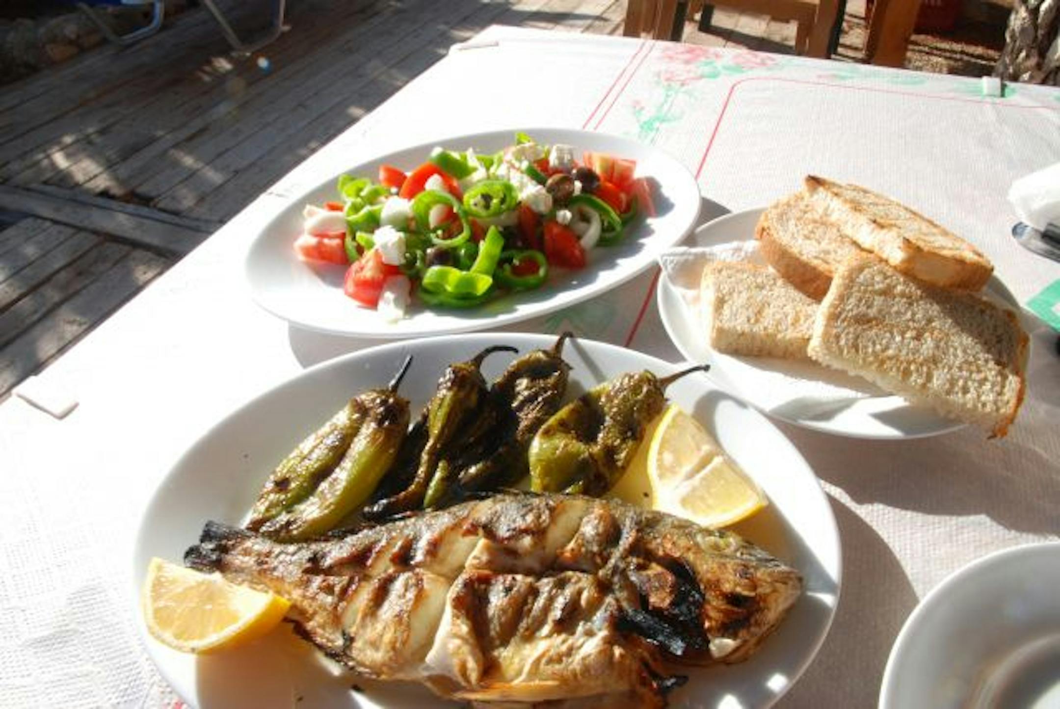 Grilled fresh fish, roasted sweet peppers and a salad of tomatoes, feta, onions and peppers are popular local fare.