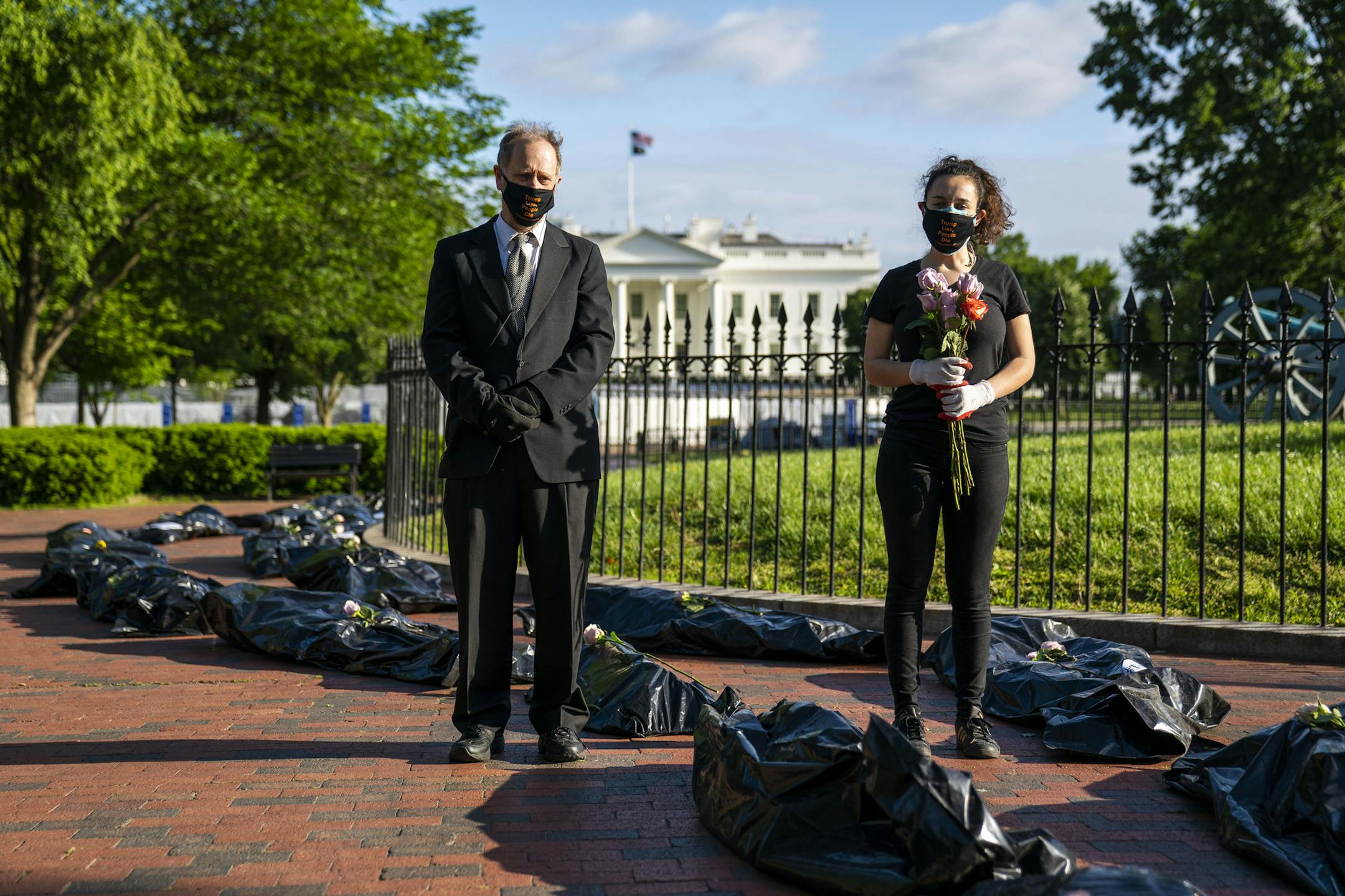 Protesters across the street from the White House in Washington, Wednesday, May 20, 2020, using plastic bags to represent body bags, protest the efforts of President Donald Trump to combat the coronavirus. (Doug Mills/The New York Times)