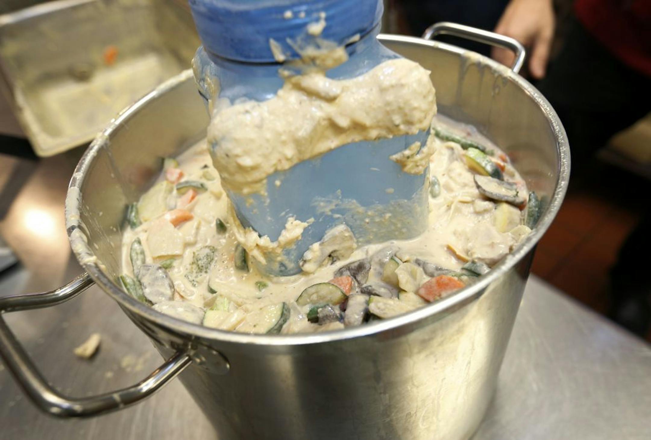 Tamara Brown owner of the Sassy Spoon in Minneapolis demonstrated how an ice wand is used to cool chicken curry. Ice wands are used to quickly cool hot food, a requirement of the food code. Foods cooked to 140 degrees must reach 41 degrees within six hours.