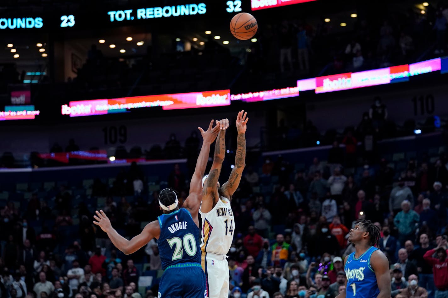 New Orleans Pelicans forward Brandon Ingram (14) launches a 3-points shot at the buzzer to defeat the Minnesota Timberwolves in the second half of an NBA basketball game in New Orleans, Tuesday, Jan. 11, 2022. The Pelicans won 128-125. (AP Photo/Gerald Herbert)