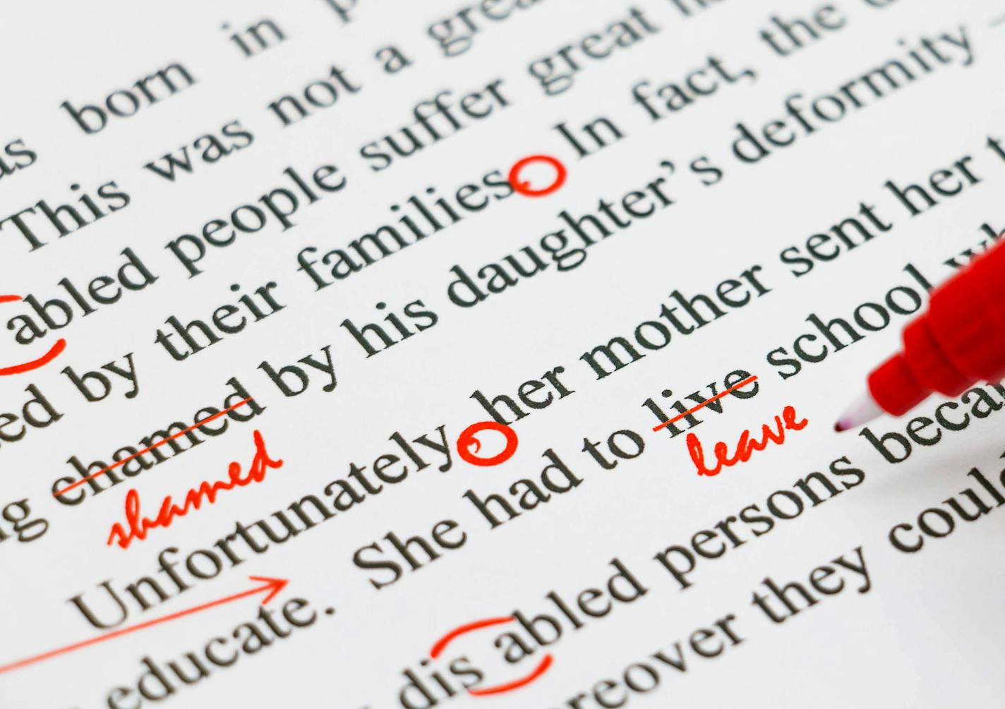 closeup red marks on proofreading english document