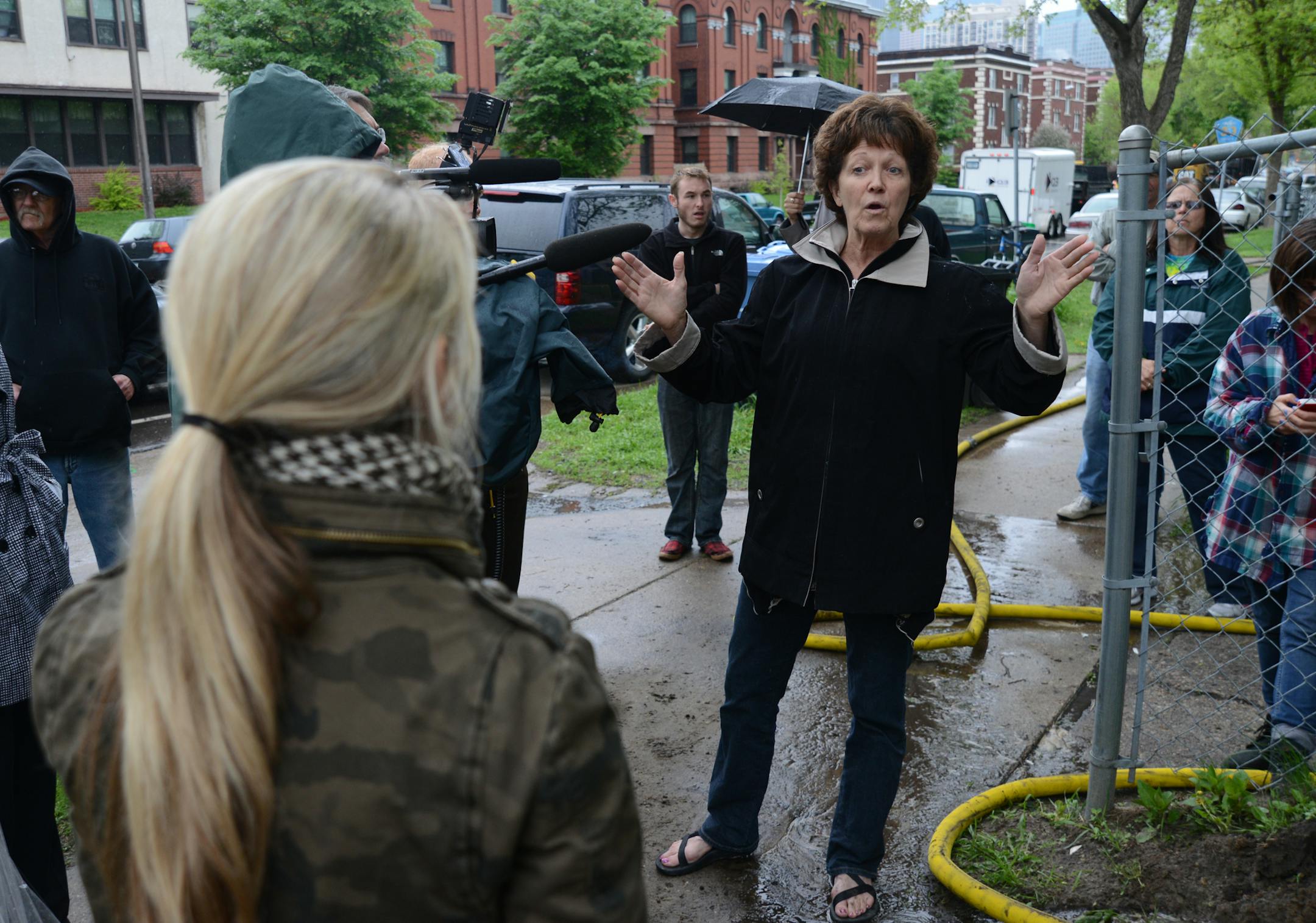 Nicole Curtis, host of cable show Rehab Addict, gave an impassioned defense of old houses Wednesday while trying to stop a demolition crew from tearing down 1925 Park Av. S. Chris Hannon a neighbor who was glad to see the crackhouse torn down said it would have cost too much to rehab; learning that Curtis hosted a national TV show that rehabbed houses, she said it's too bad she didn't get involved earlier and save the house. ] Richard.Sennott@startribune.com Richard Sennott/Star Tribune. , Minne