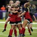 Centennial midfielder Madison Monson (11), left, celebrated her penalty kick goal with Centennial forward Khyah Harper (7) and other players in the se