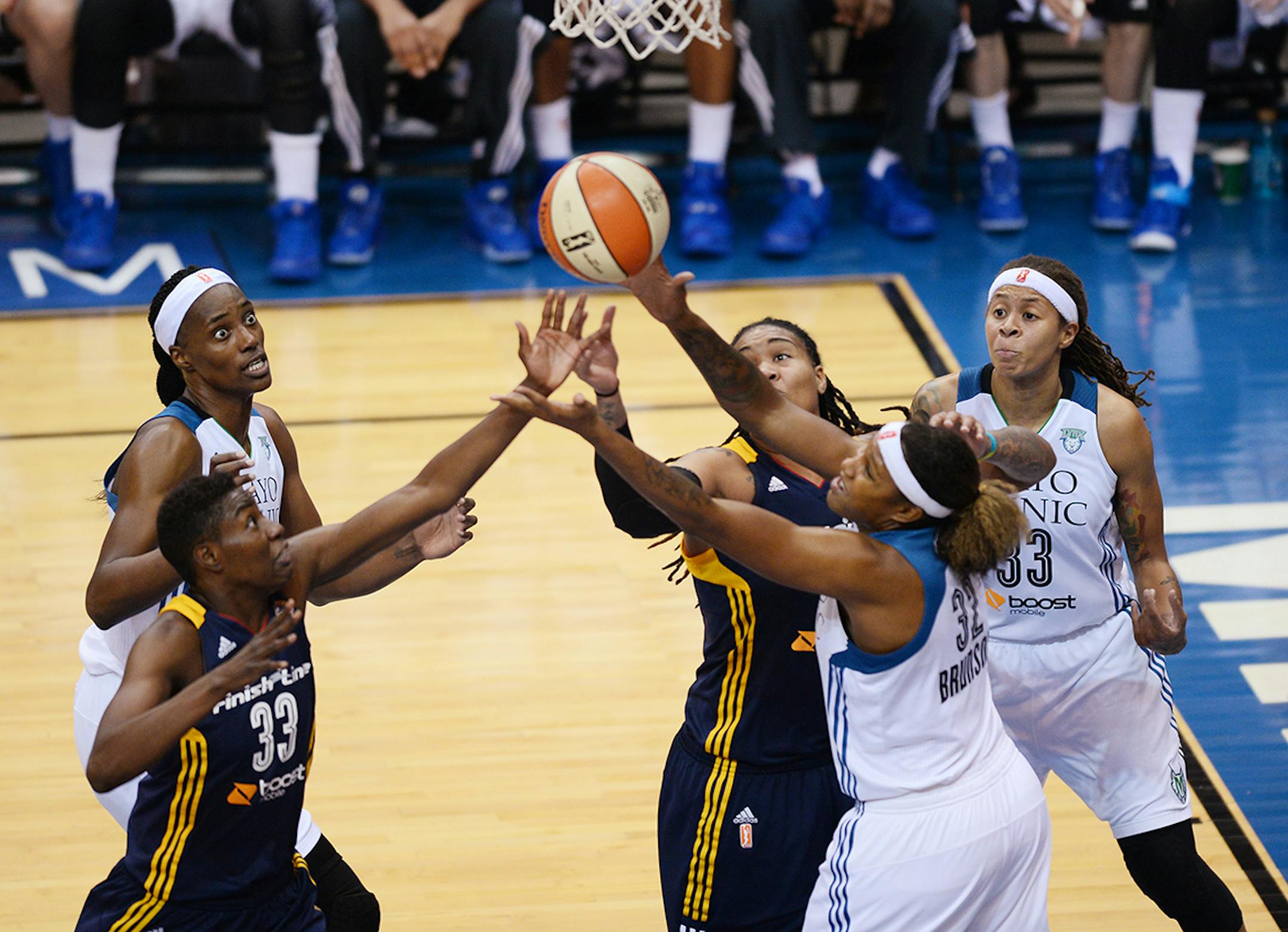Minnesota Lynx center Sylvia Fowles (34), from left, Indiana Fever forward Natasha Howard (33) Indiana Fever forward Erlana Larkins (2), Minnesota Lynx forward Rebekkah Brunson (32) and Minnesota Lynx guard Seimone Augustus (33) look for a rebound during the second half.
