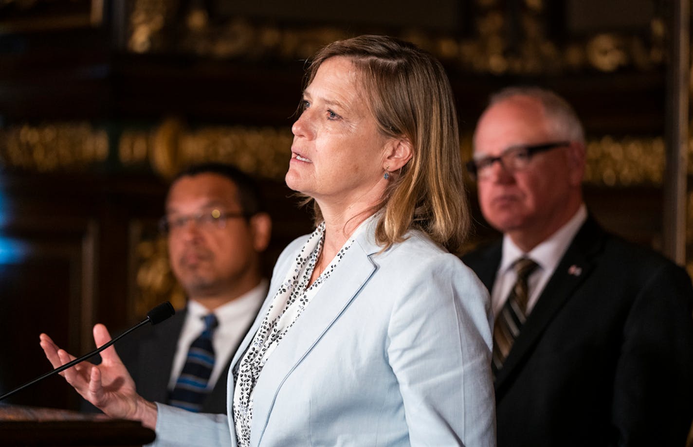 Attorney General Keith Ellison, Department of Labor and Industry Commissioner Nancy Leppink and Gov. Tim Walz after the bill signing ceremony.