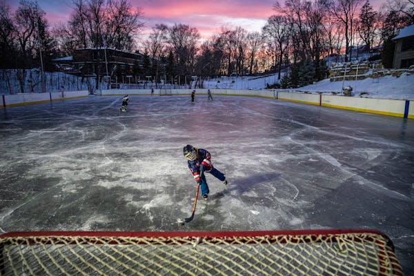 Chip Dulin,7, moves in on an open net on Bill Traff's Olympic size rink in Long Lake, Minn., on Tuesday, Jan. 11, 2022. Minnesota is the country's cap