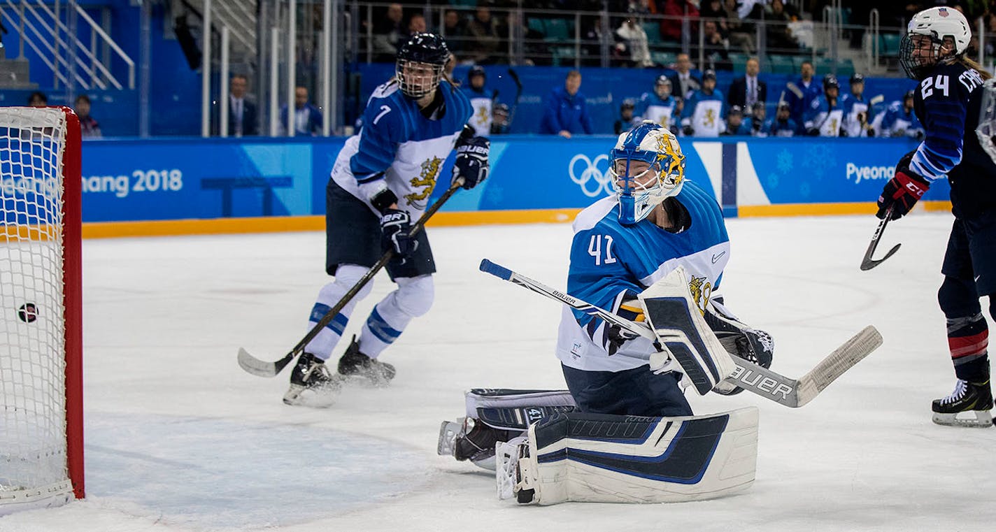 Dani Cameranesi (24) got the puck past Team Finland goalie and former Minnesota Gopher Noora Raty (41) for a goal in the first period.