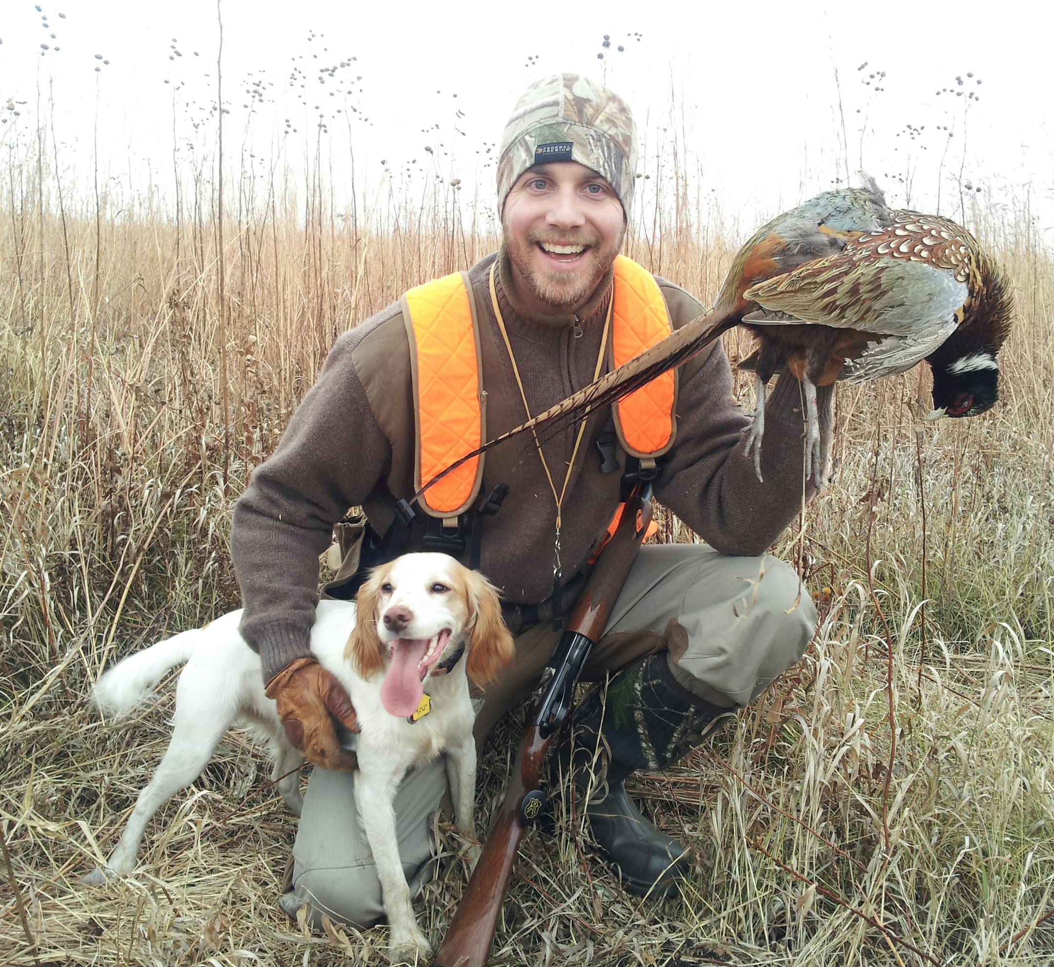 Anthony Hauck of Roseville with his dog, Sprig, during a successful pheasant hunt.