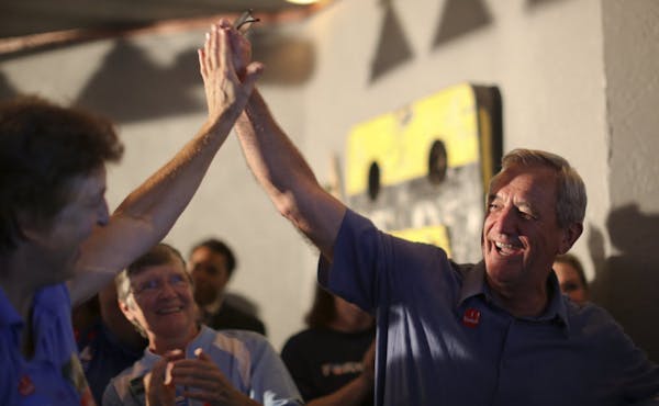 Rick Nolan, right, celebrated his victory in the 8th District DFL primary with supporters at the Moonshine Lounge in Brainerd late Tuesday night.