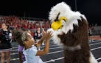 The Eden Prairie eagle mascot greets young fans in the fourth quarter of the game against Lakeville South Friday, September 16, 2022 at Eden Prairie H