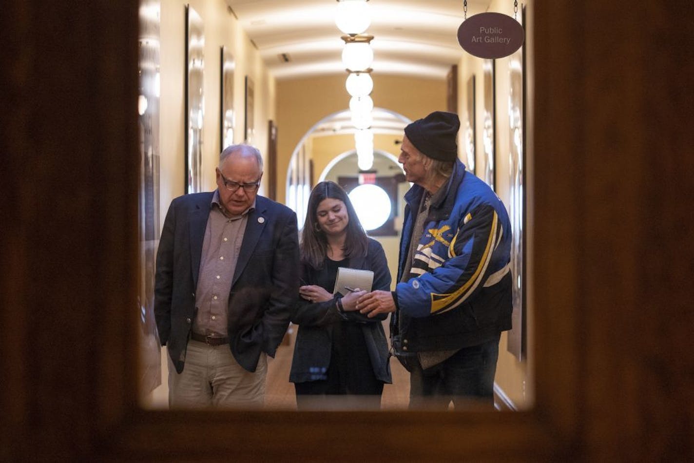 Governor-elect Tim Walz and former Gov. Jesse Ventura leave a meeting inside the Minnesota State Capitol in St. Paul, Minn. on Tuesday, Nov. 13, 2018.