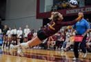 Minnesota Gophers CC McGraw (7) dove a got the dig in the second set. Texas defeated Minnesota 3-1.
