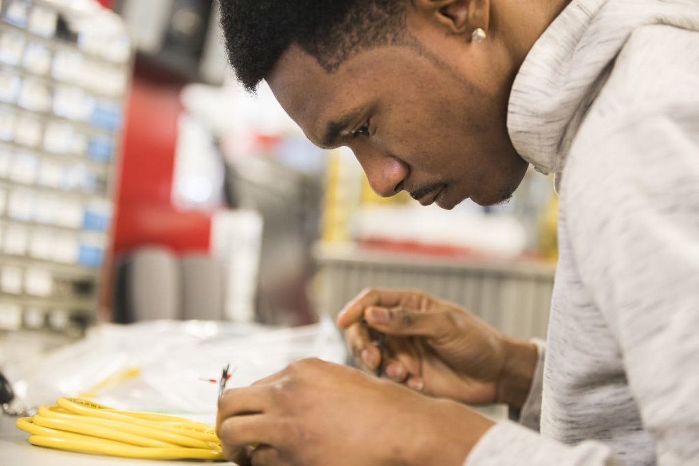 Kamonty Wade works on building an ethernet hub box at Rudolph Technologies.