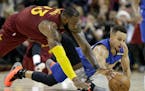 Kyrie Irving is gone to Boston, but LeBron James (left, scrambling for a loose ball against the Warriors Stephen Curry) remains and that will be enoug