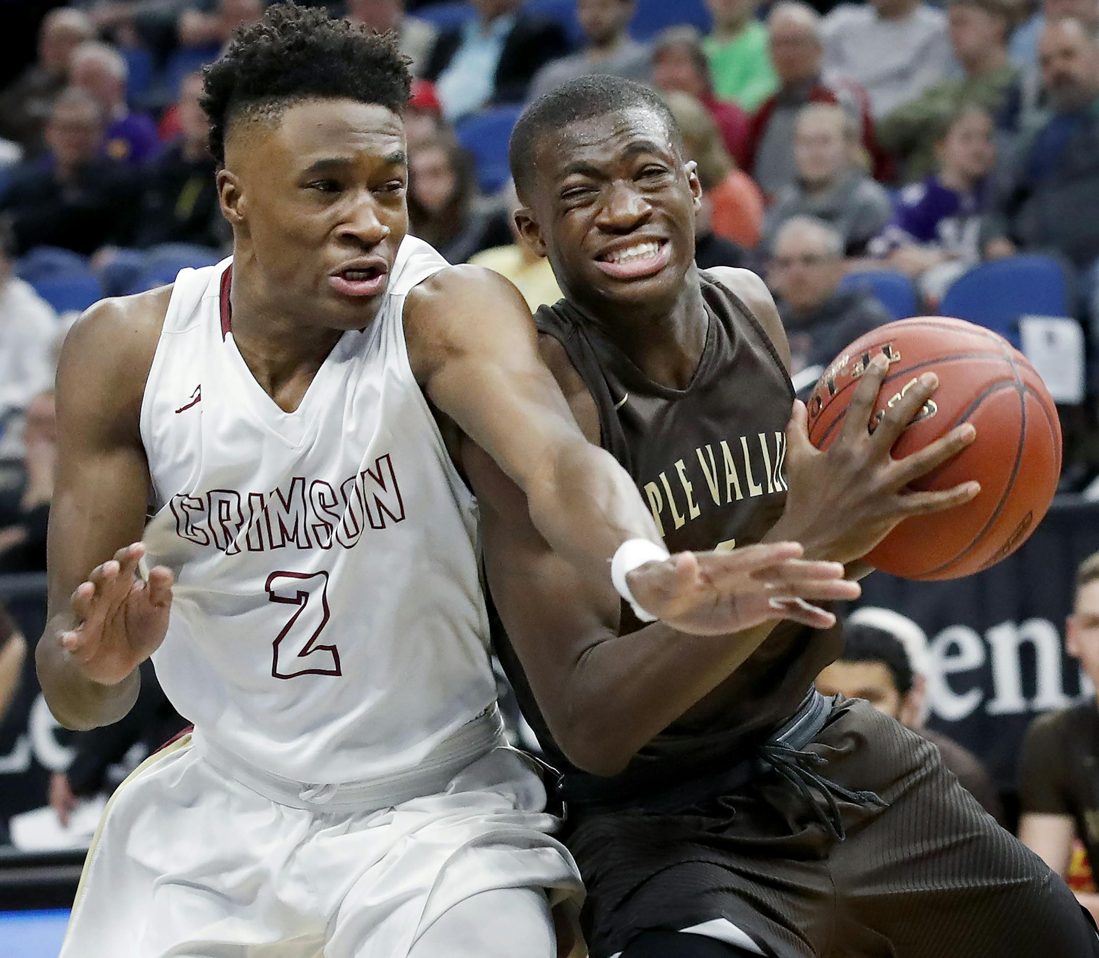 Mohamed Kone (1) of Apple Valley was defended by Gare Ewefada (2) of Maple Grove in the second half. ] CARLOS GONZALEZ &#xef; cgonzalez@startribune.com - March 23, 2017, Minneapolis, MN, Target Center, Minnesota State High School League Boys&#xed; Basketball State Tournament, Quarterfinals, Class 4A semifinals, Maple Grove vs. Apple Valley