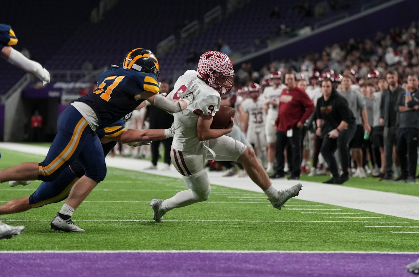 Maple Grove Crimson quarterback Jacob Kilzer (9) is ousted out of bounds at the one yard line in the second half. Rosemount Irish played the Maple Grove Crimson in the Class 6A championship game on Friday, Dec. 2, 2022 at U.S. Bank Stadium in Minneapolis, Minn. ] RENEE JONES SCHNEIDER • renee.jones@startribune.com