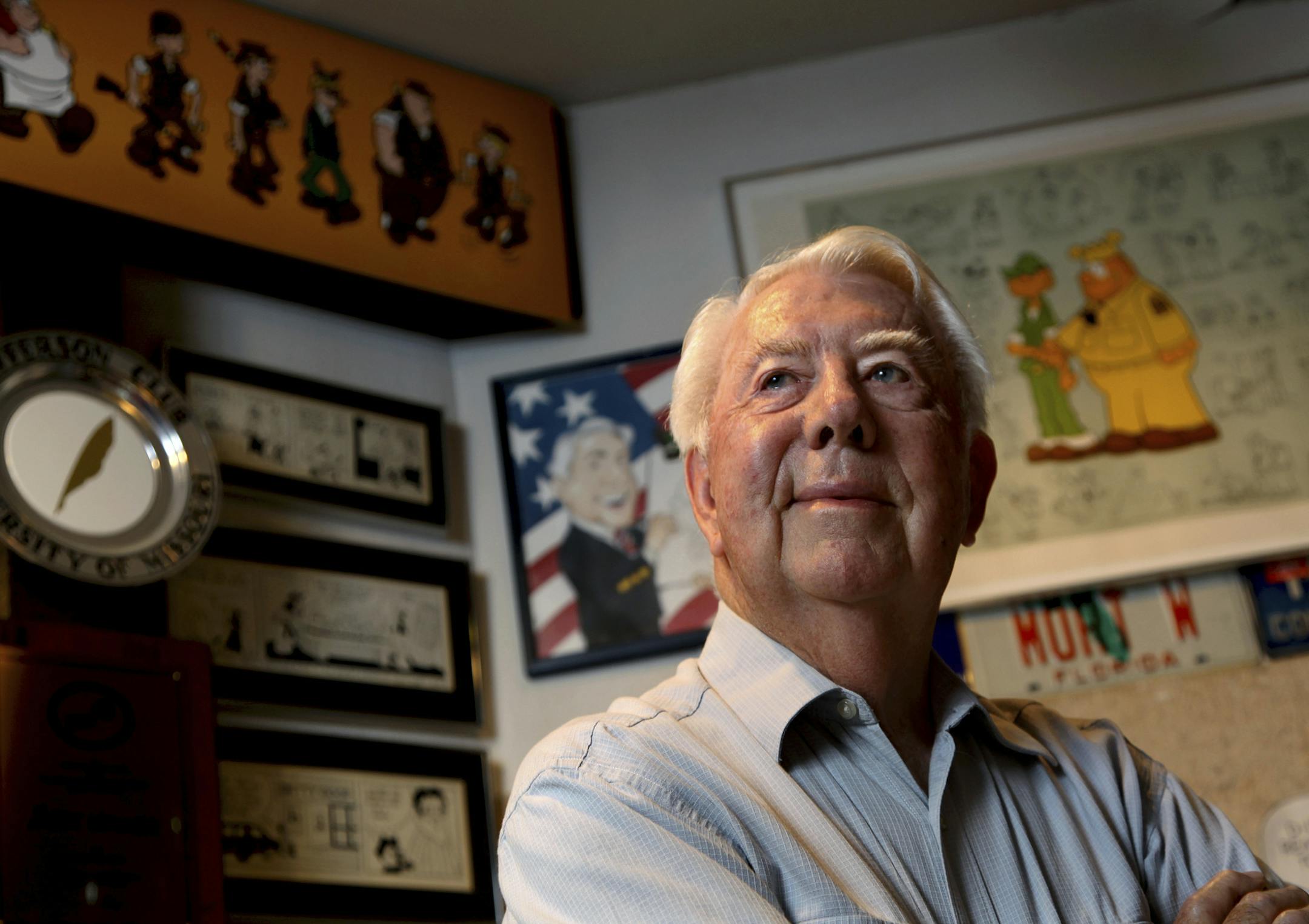 FILE - In this Aug. 16, 2010 file photo, Mort Walker, the artist and author of the Beetle Bailey comic strip, stands in his studio in Stamford, Conn. On Saturday, Jan. 27, 2018, a family member said the comic strip artist has died. He was 94. (AP Photo/Craig Ruttle)