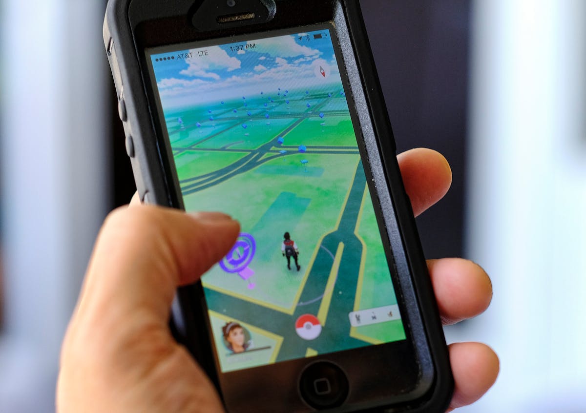 Pokemon Go is displayed on a cell phone in Los Angeles on Friday, July 8, 2016. Just days after being made available in the U.S., the mobile game Poke