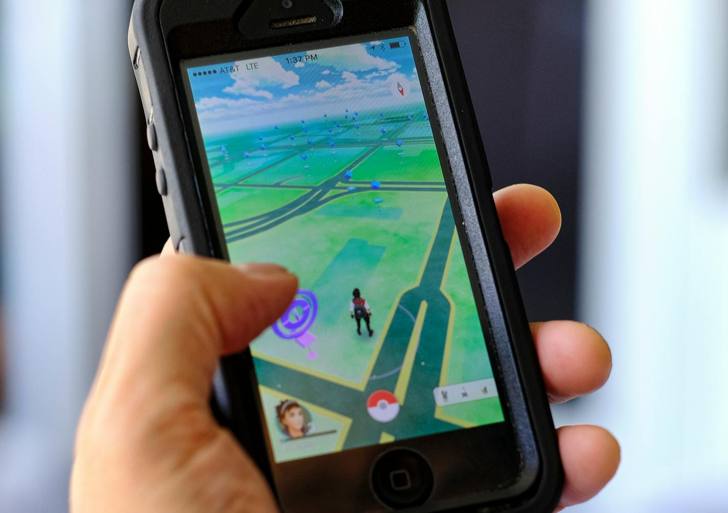 Pokemon Go is displayed on a cell phone in Los Angeles on Friday, July 8, 2016. Just days after being made available in the U.S., the mobile game Pokemon Go has jumped to become the top-grossing app in the App Store.