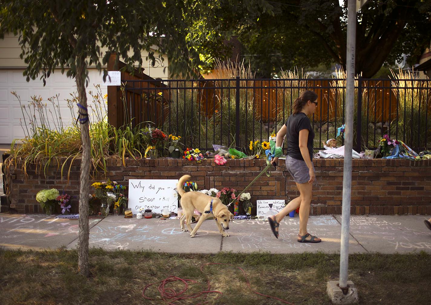 The sidewalk memorial to Justine Damond on W. 51st. St. in the Fulton neighborhood Monday night.