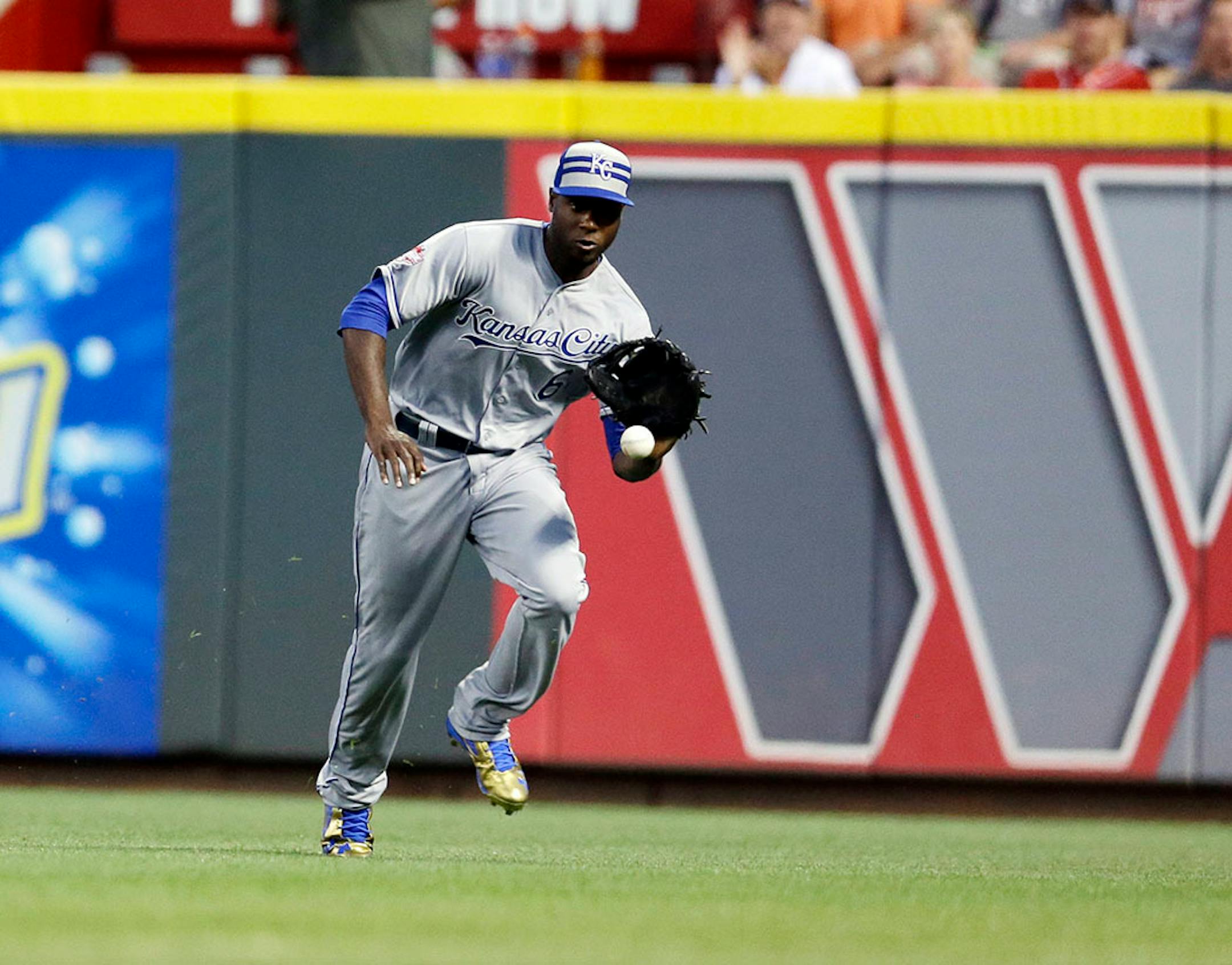 American League's Lorenzo Cain, of the Kansas City Royals, makes a play on a ball hit by National League's Jhonny Peralta, of the St. Louis Cardinals, during the second inning of the MLB All-Star baseball game, Tuesday, July 14, 2015, in Cincinnati.