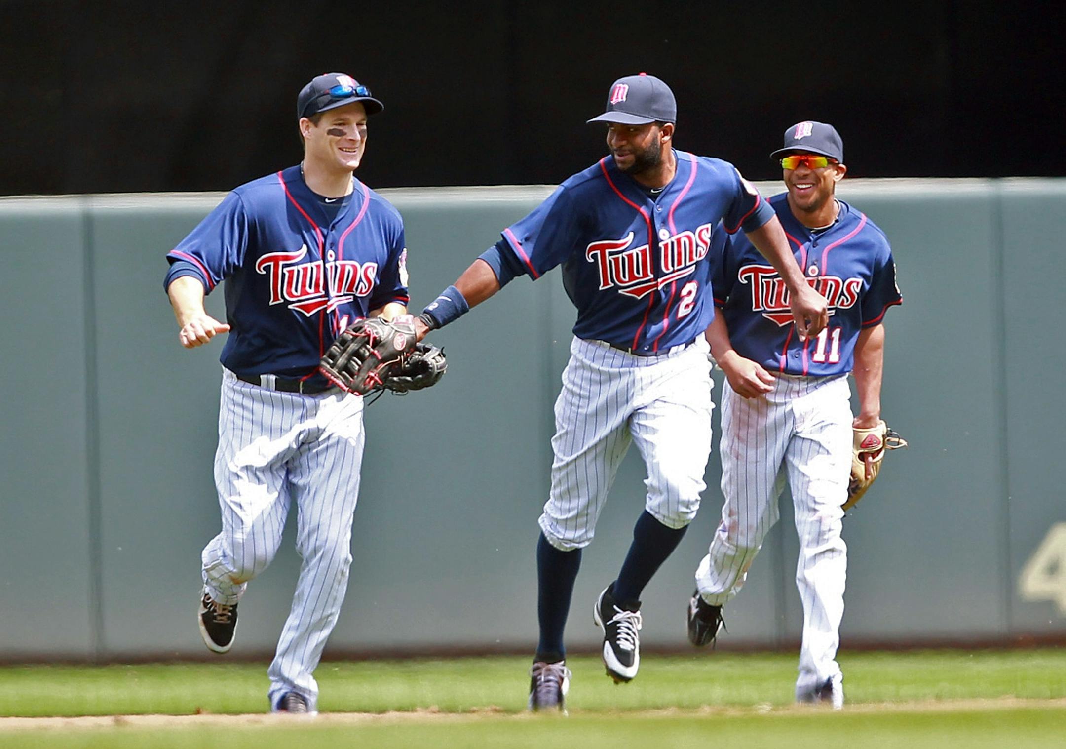 Denard Span celebrated with Josh Willingham, left, and Ben Revere, right after the Twins defeated Oakland 4-0 on Wednesday to sweep the three-game series.