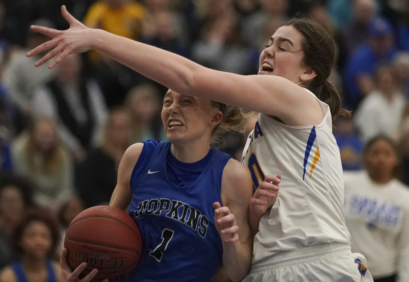 Hopkins Royals Paige Bueckers (1) drove to the net in the second half while defended by Wayzata Trojans Annika Stewart (30). ] JEFF WHEELER &#x2022; jeff.wheeler@startribune.com Hopkins defeated Wayzata 77-60 in a Class 4A, section 6 girls' basketball final at Hopkins High School in Minnetonka Thursday night.