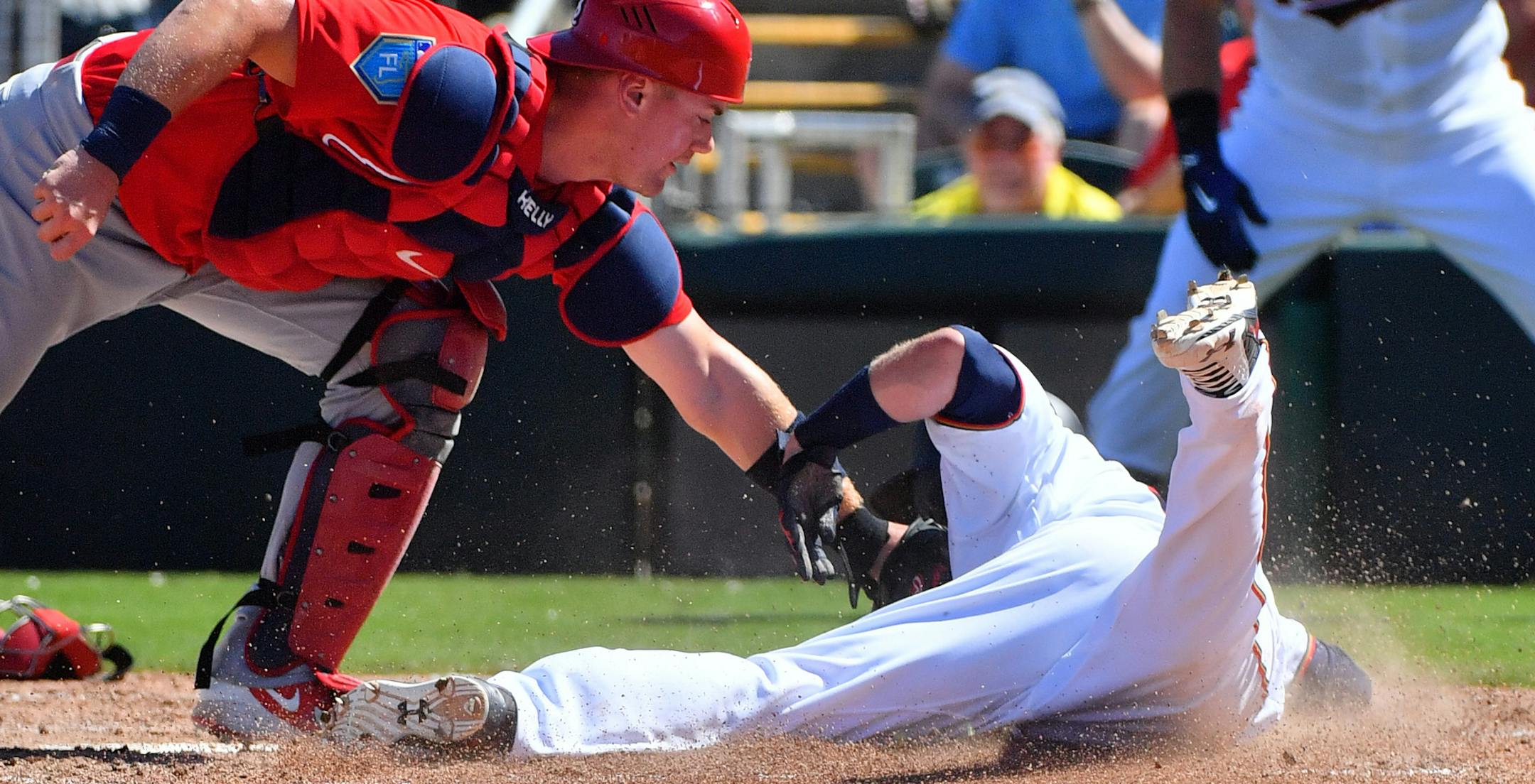 Cardinals catcher Carson Kelly tagged out Twins second baseman Brian Dozier (2) at home in the third inning. ] MARK VANCLEAVE ï mark.vancleave@startribune.com * The St. Louis Cardinals played the Minnesota Twins at Hammond Stadium in Fort Myers, Florida on Monday, Feb. 26, 2018.
