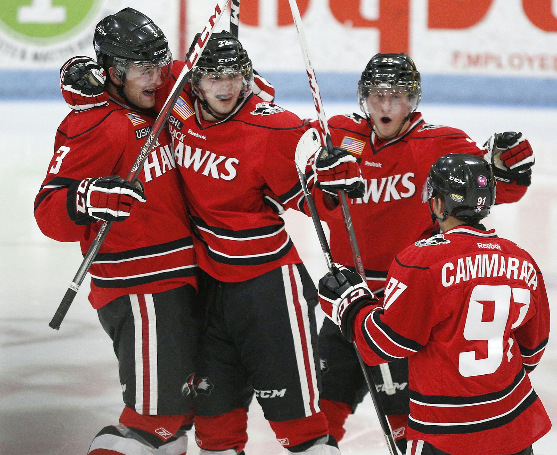Waterloo Black Hawks' Zach Stepan, center left, celebrates his power play goal with Ian McCoshen, left, Justin Kloos, center right, and Taylor Cammarata, right, in the second period Monday, Dec. 31, 2012, in Waterloo, Iowa. (MATTHEW PUTNEY / Courier Photo Editor)