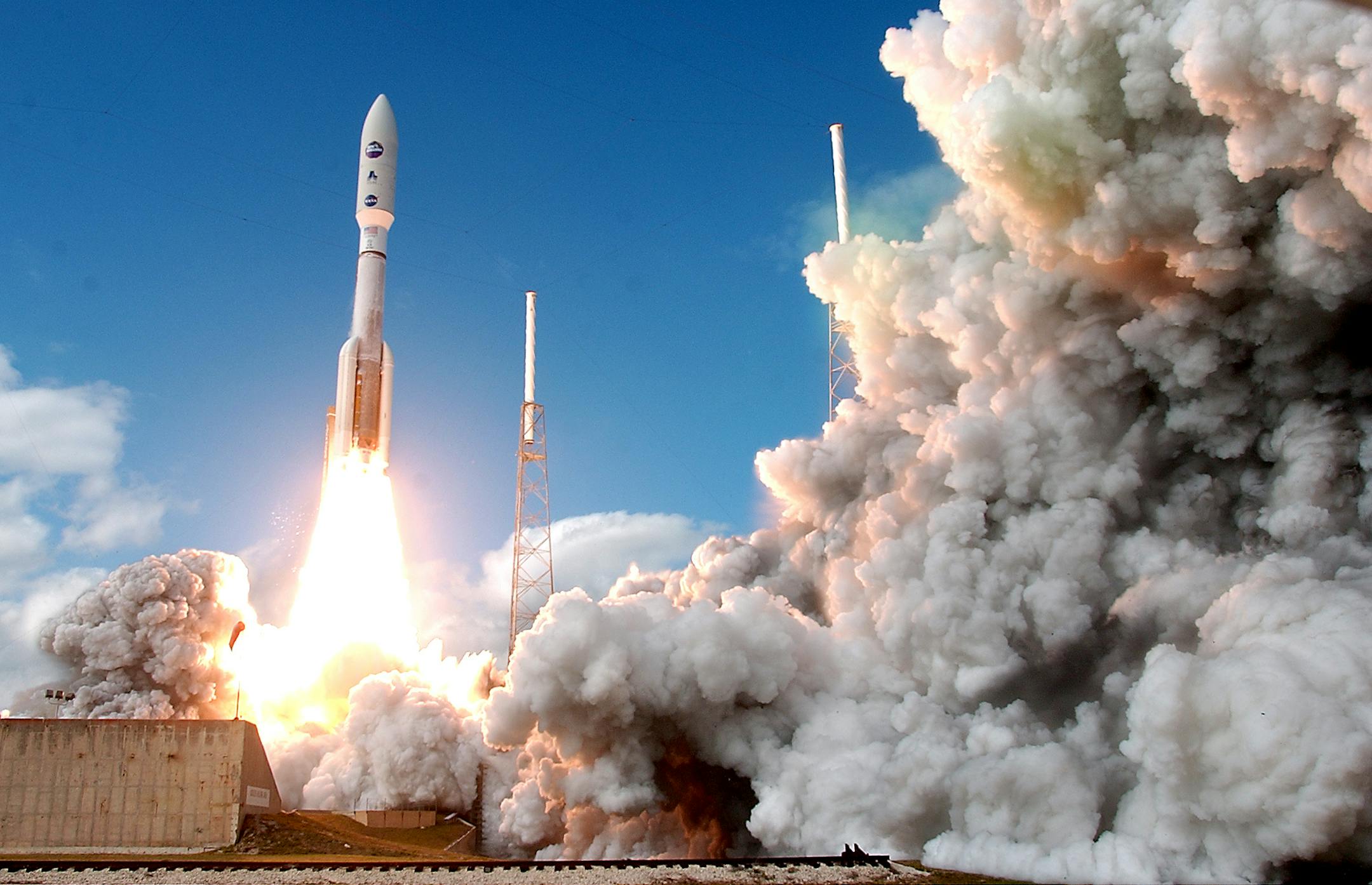 In this Thursday, Jan. 19, 2006, file photo, an Atlas V rocket that carried the New Horizons spacecraft to Pluto lifts off at the Cape Canaveral Air Force Station in Florida. It took the spacecraft around 9 1/2 years to reach Pluto, but that journey paid dividends in 2015.