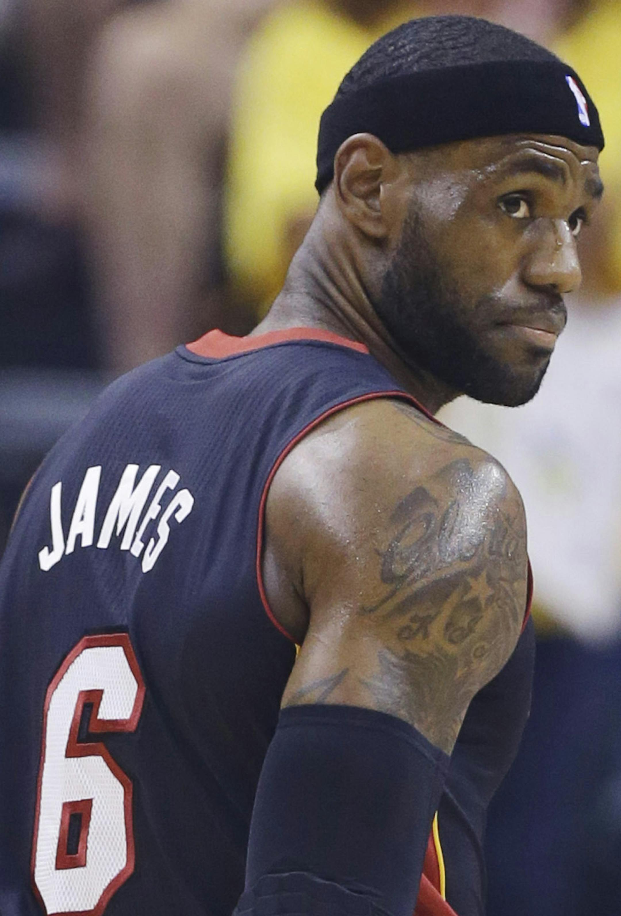 Miami Heat forward LeBron James heads to the bench during the first half of Game 5 of the NBA basketball Eastern Conference finals against the Indiana Pacers, in Indianapolis on Wednesday, May 28, 2014. (AP Photo/Michael Conroy) ORG XMIT: NAF108